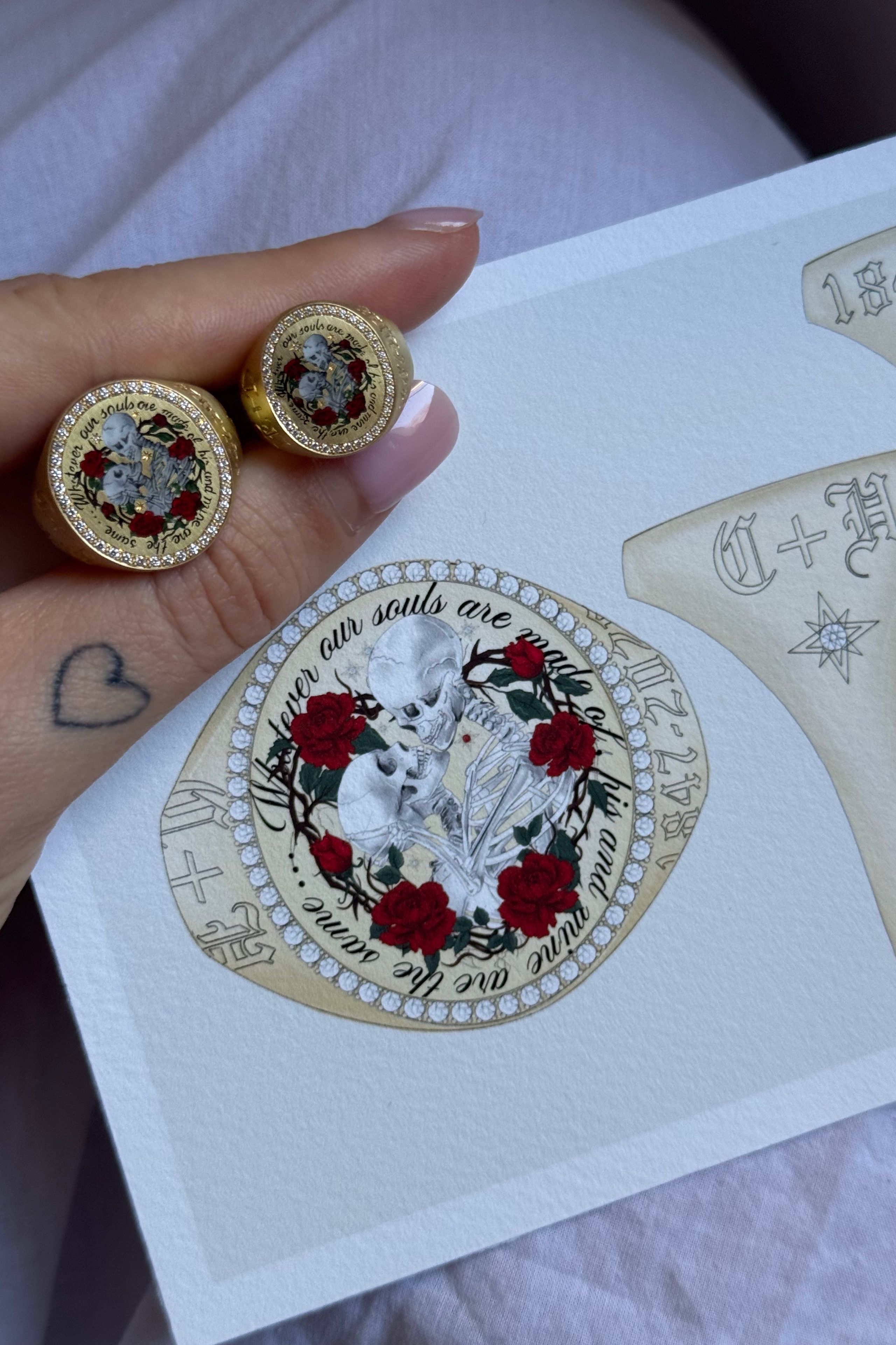 Image may contain Accessories Jewelry Locket Pendant Person Skin and Tattoo