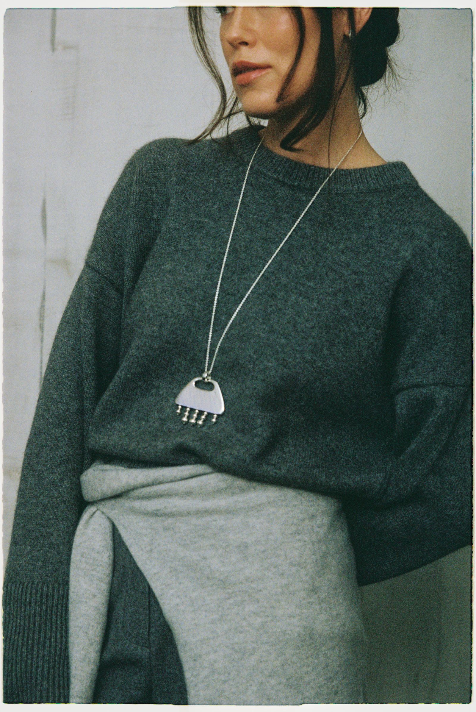 Image may contain Accessories Pendant Adult Person Jewelry Necklace Face and Head